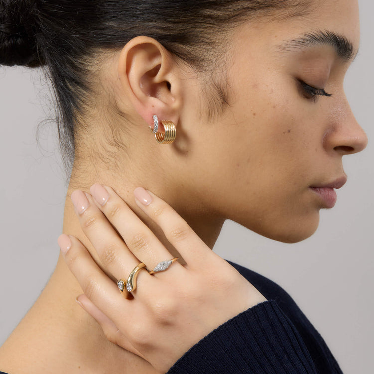 Model wearing Perfect Pear Diamond Hug Ring with solid gold Stone and Strand jewelry