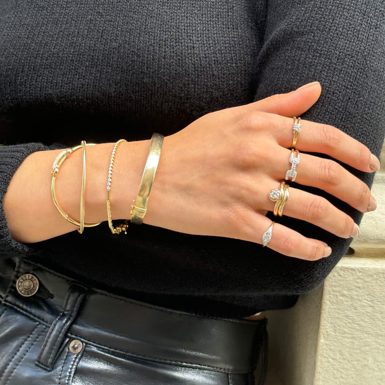 Model wearing Liquid Gold Stretch Bracelet with solid gold Stone and Strand jewelry