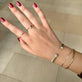 Model wearing The Diana Ring with solid gold Stone and Strand jewelry