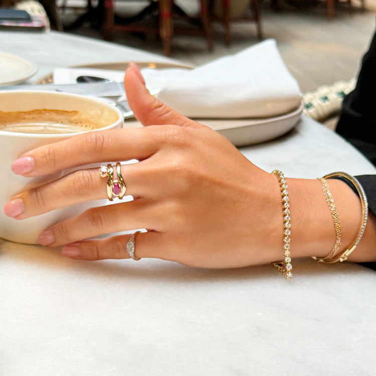 Model wearing DIamond Stroke Tennis Bangle with solid gold Stone and Strand jewelry