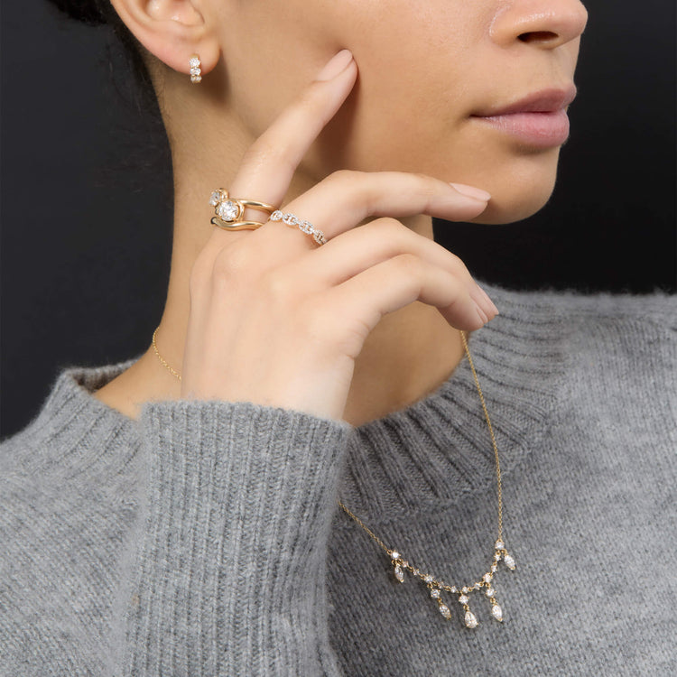 Model wearing 1CTW Lab-Created Diamond Bonbon Merge Ring with solid gold Stone and Strand jewelry