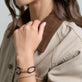 Model wearing Beacon Friendship Bracelet with solid gold Stone and Strand jewelry