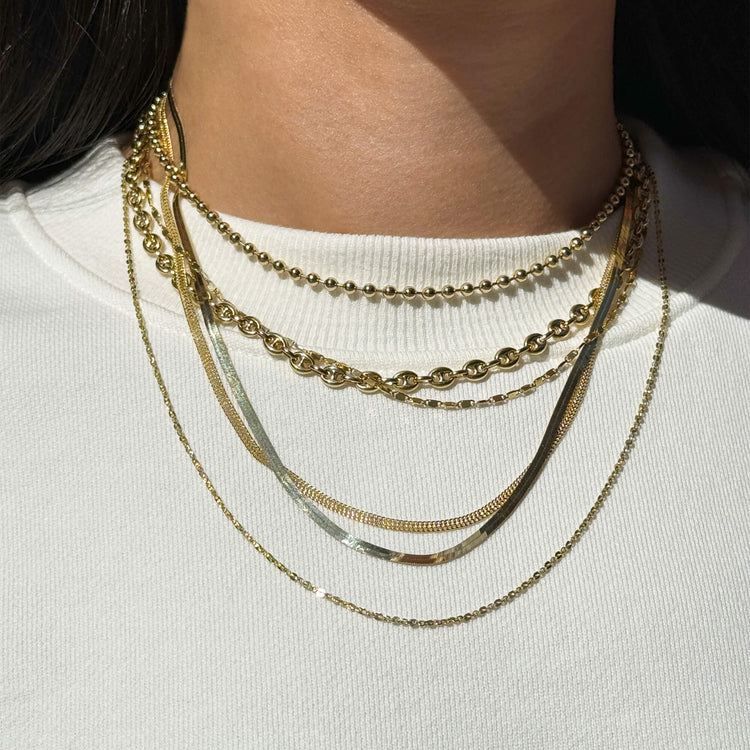 Image of 14K Yellow Gold Pivot by Stone and Strand Smashed Rolo Chain on Models Neck