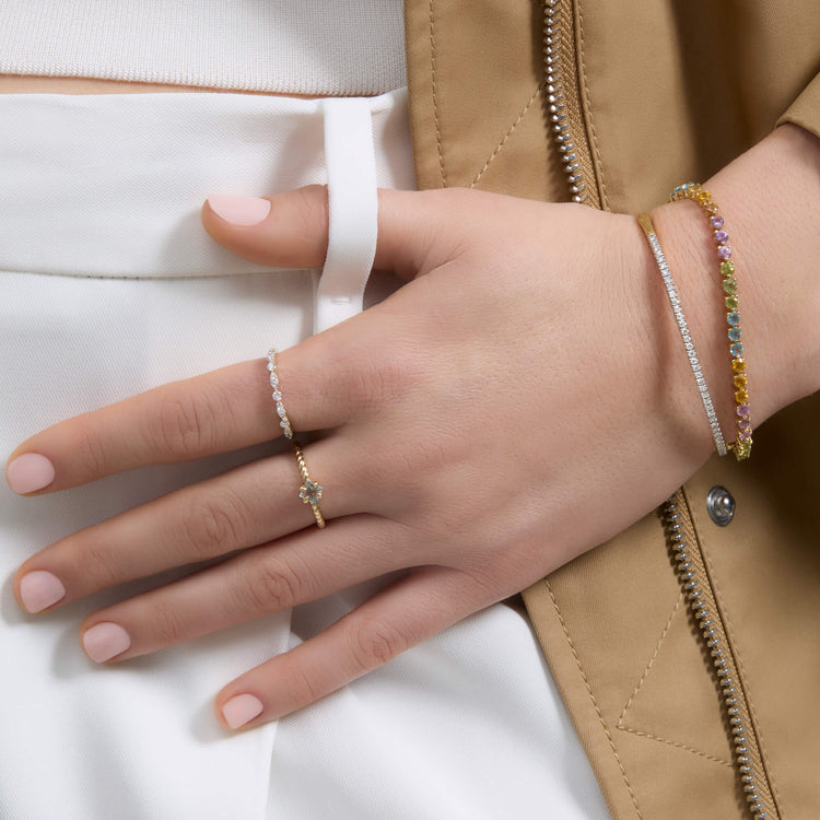 Model wearing Blue Lagoon Aquamarine Ring with solid gold Stone and Strand jewelry