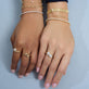 Model wearing 4-5CTW Lab-Created Tennis Bracelet with solid gold Stone and Strand jewelry