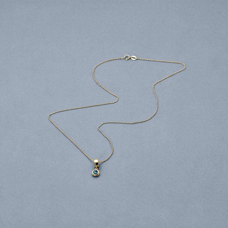 Stone and Strand 14K Yellow Gold My Little Evil Eye Charm Editorial Image