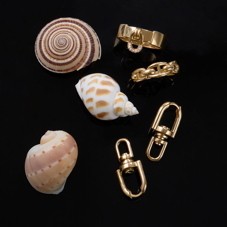Still life image of Nantucket Knot Ring with Stone and Strand solid gold jewelry