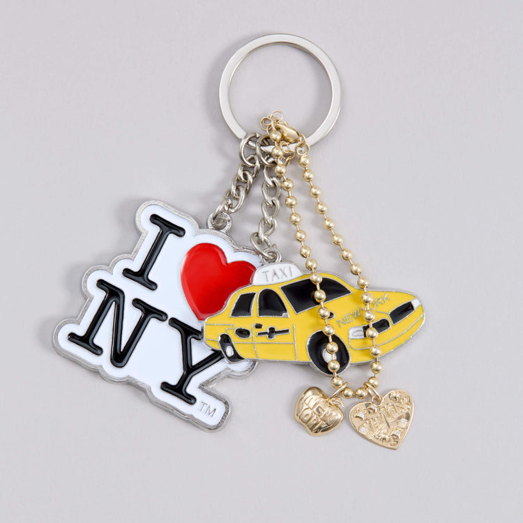 Still life image of The Big Apple Charm with Stone and Strand solid gold jewelry