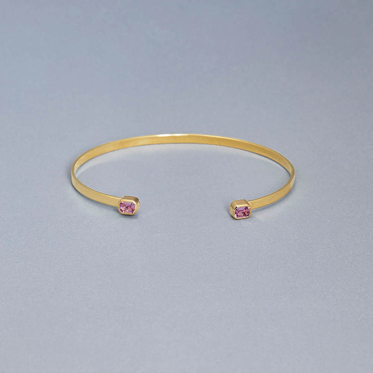 Stone and Strand 10K Yellow Gold Orchid Pink Sapphire Baguette Cuff Editorial Image