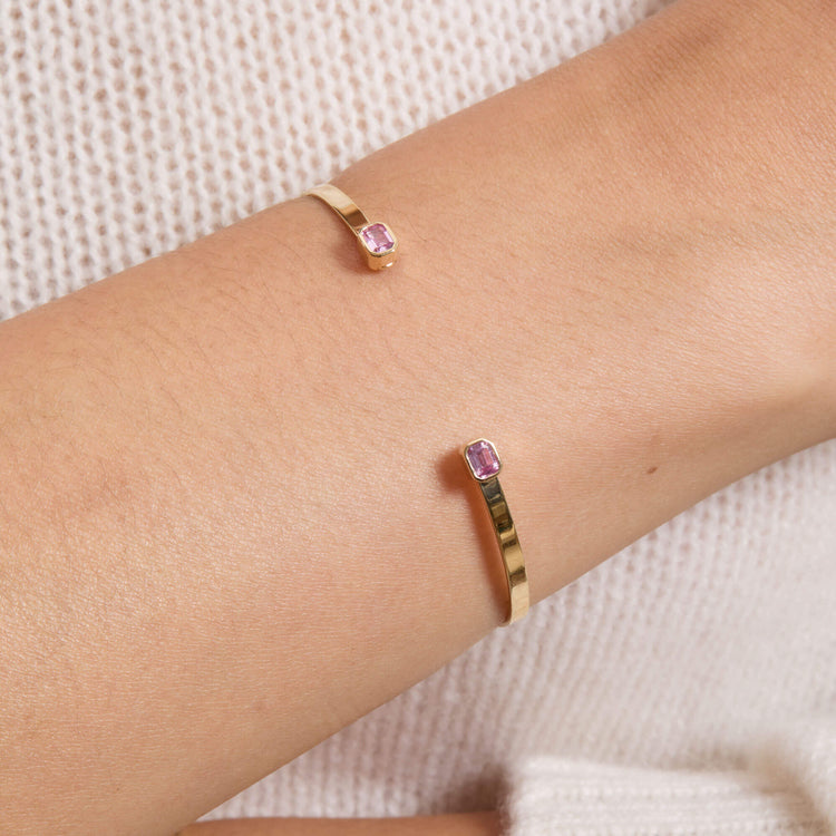 Image of 10K Yellow Gold Orchid Baguette Cuff with Pink Sapphire on Models Arm