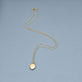 Stone and Strand 14K Yellow Gold Oval Essenital Locket Charm Editorial Image