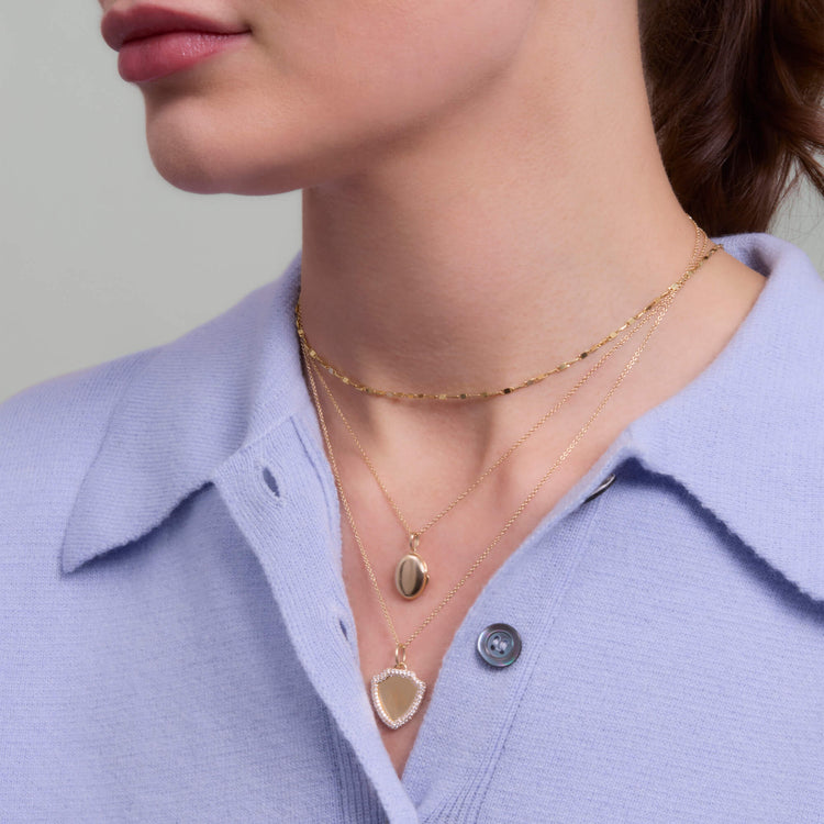 Image of 14K Yellow Gold Oval Essential Locket Charm with Stone and Strand Necklaces