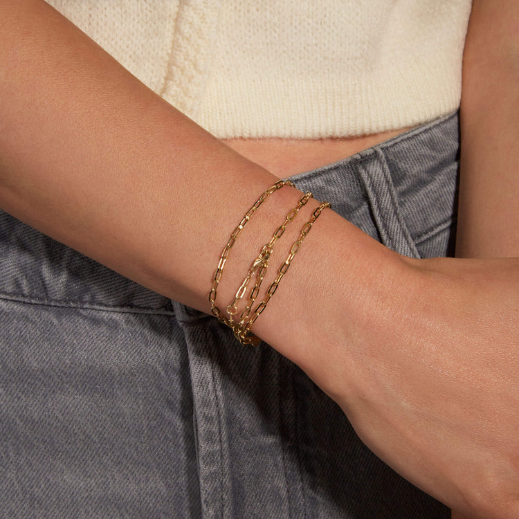Image of 14K Yellow Gold Pivot by Stone and Strand Paperclip Chain on Models Arm