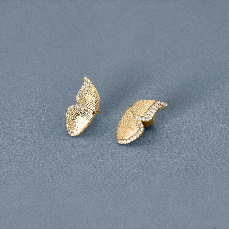 Stone and Strand 14K Yellow Gold Pave Diamond Butterfly Wings Earrings Editorial image