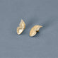 Stone and Strand 14K Yellow Gold Pave Diamond Butterfly Wings Earrings Editorial image