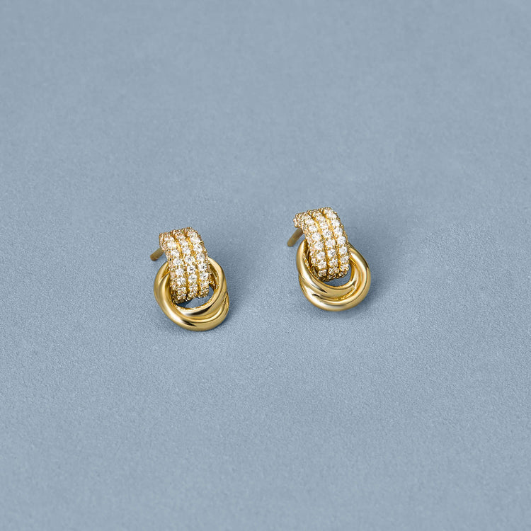 Stone and Strand 14K Yellow Gold Pave Diamond Forme Knot Studs Editorial Image