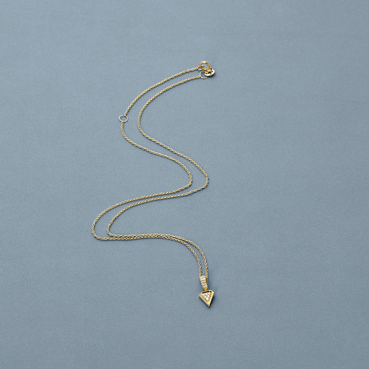 Stone and Strand 14K Yellow Gold Pave Knife Edge Shield Necklace Editorial Image