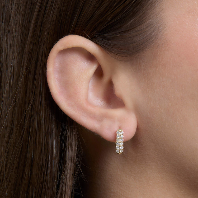 Image of 14K Yellow Gold Pave Knife Edge Wide Huggies on Models Ear