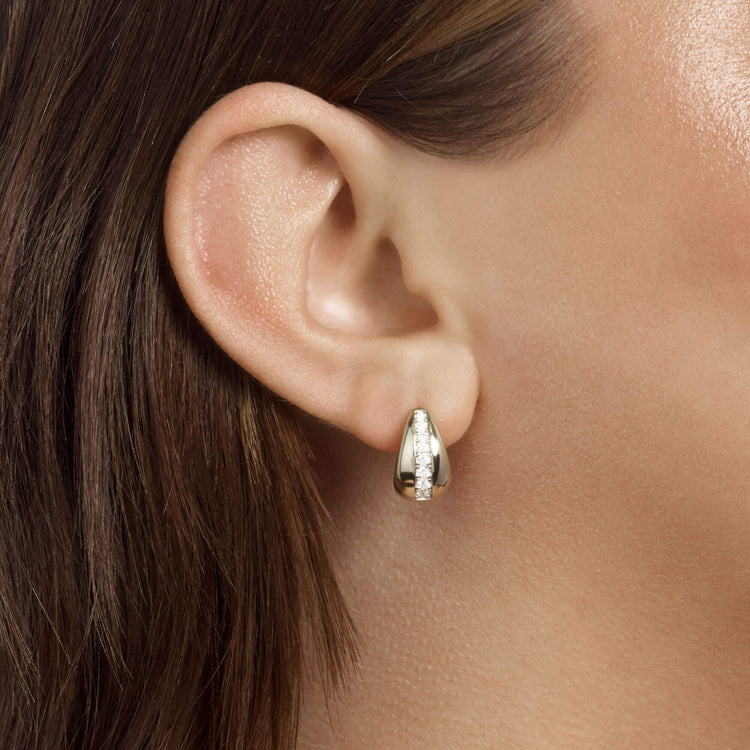 Image of 10K Yellow Gold Pave Pistachio Diamond Huggies on Models Ear