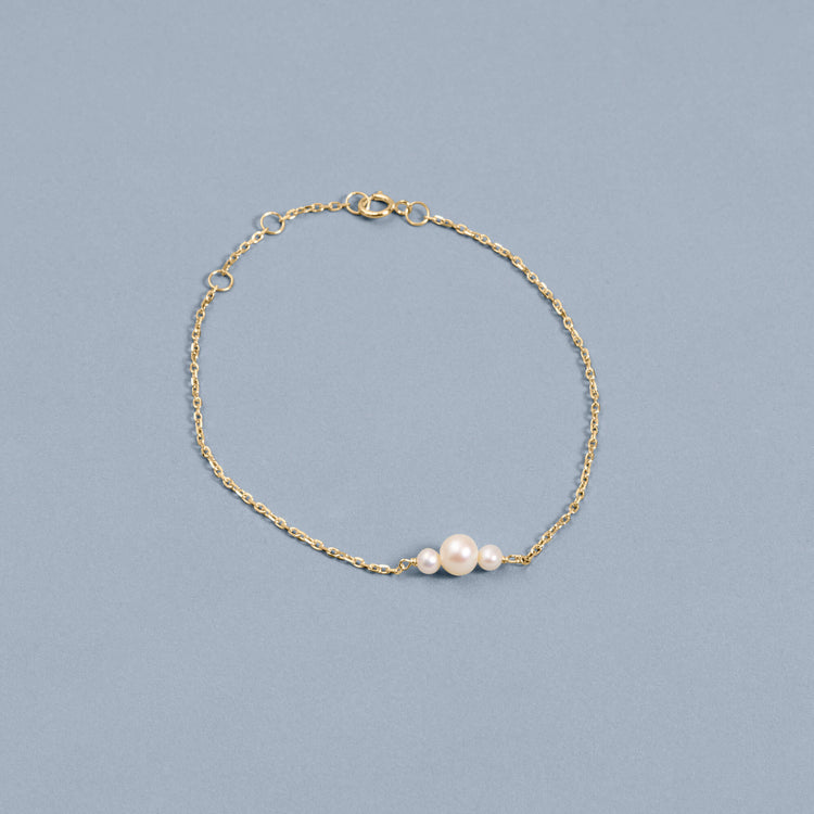 Stone and Strand 14K Yellow Gold Pearl Trio Bracelet Editorial Image