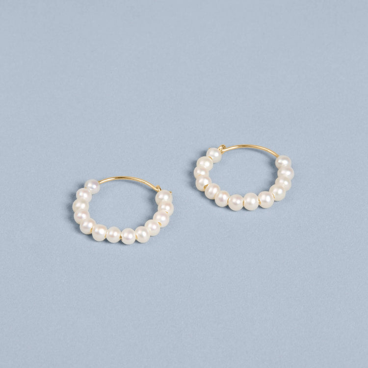 Stone and Strand 10K Yellow Gold Pearly Huggies Editorial Image