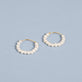 Stone and Strand 10K Yellow Gold Pearly Huggies Editorial Image