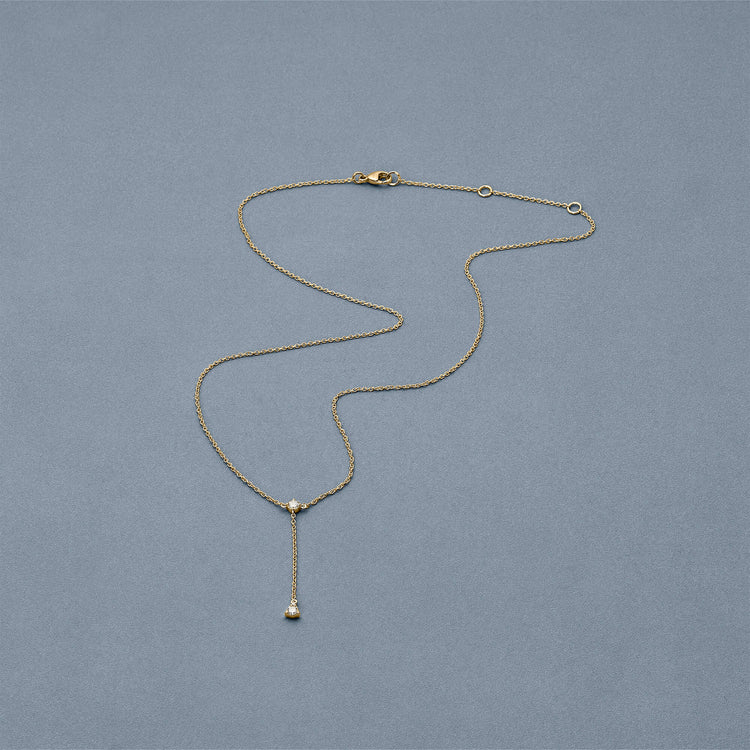 Stone and Strand 14K Yellow Gold Perfect Pear Diamond Lariat Necklace Editorial Image
