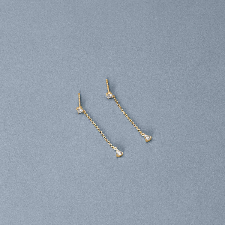 Stone and Strand 14K Yellow Gold Perfect Pear Diamond Line Earrings Editorial Image