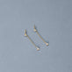 Stone and Strand 14K Yellow Gold Perfect Pear Diamond Line Earrings Editorial Image