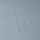 Stone and Strand 14K Yellow Gold Perfect Pear Diamond Threader Earrings Editorial Image