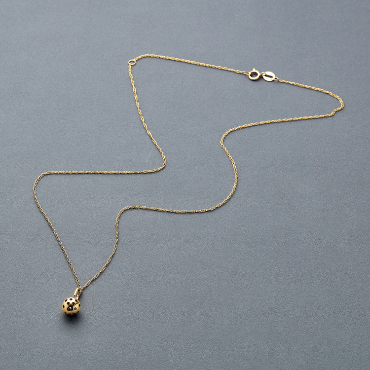Stone and Strand 10K Yellow Gold Pickle Baller Necklace Editorial Image