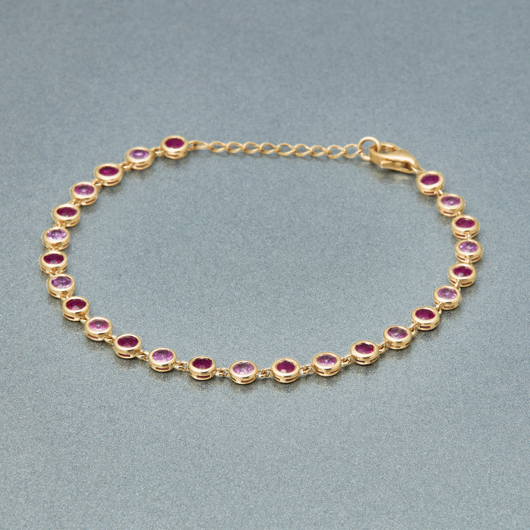 Stone and Strand 10K Yellow Gold Pink Power Pink Sapphire and Ruby Bubble Bracelet Editorial Image