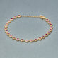 Stone and Strand 10K Yellow Gold Pink Power Pink Sapphire and Ruby Bubble Bracelet Editorial Image