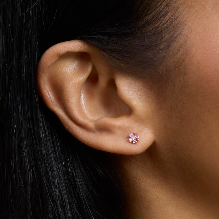 Image of 10K Yellow Gold Pink Sapphire and Diamond Flower Stud on Models Ear