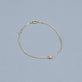 Stone and Strand 10K Yellow Gold Pink Sapphire Flower Bracelet Editorial Image