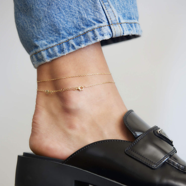 Image of 14K Yellow Gold Pivot by Stone and Strand 4-Way DC Cable Chain on Models Ankle