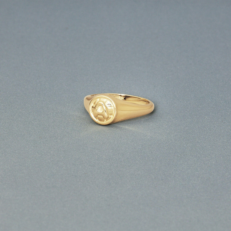 Stone and Strand 14K Yellow Gold Puff Puff Button Initial Ring Editorial Image