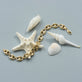 Still life image of Puffed XL Maritime Bracelet with Stone and Strand solid gold jewelry