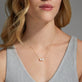 Image of 10K Yellow Gold Pear and Heart Toi et Moi Necklace with White Topaz on Models Neck
