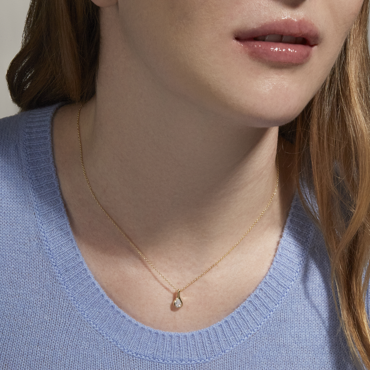 Image of 10K Yellow Gold Perfect Pear Diamond Droplet Necklace on Models Neck