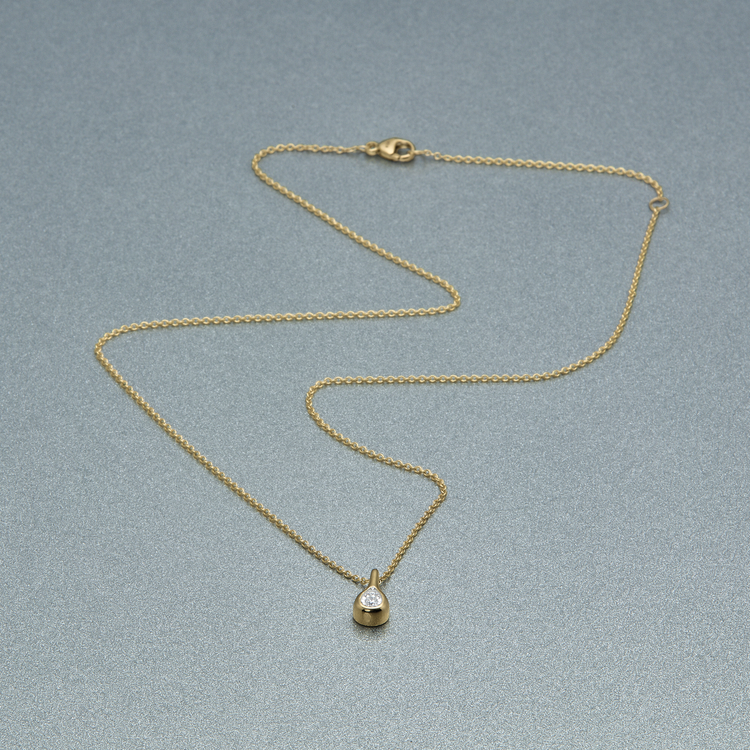 Stone and Strand 10K Yellow Gold Perfect Pear Diamond Droplet Necklace Editorial Image