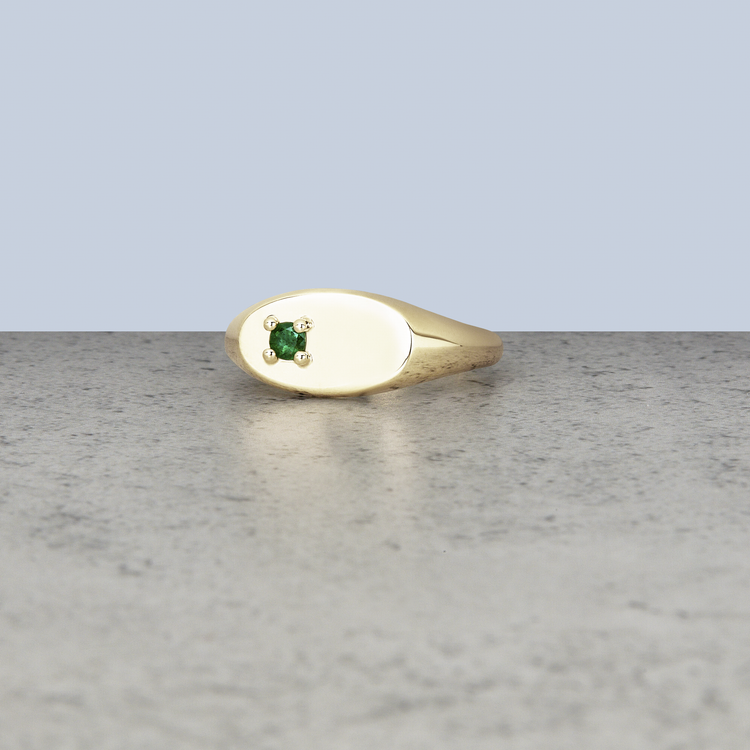 Stone and Strand 10K Yellow Gold Personalized Birthstone Signet Ring with Emerald Editorial Image
