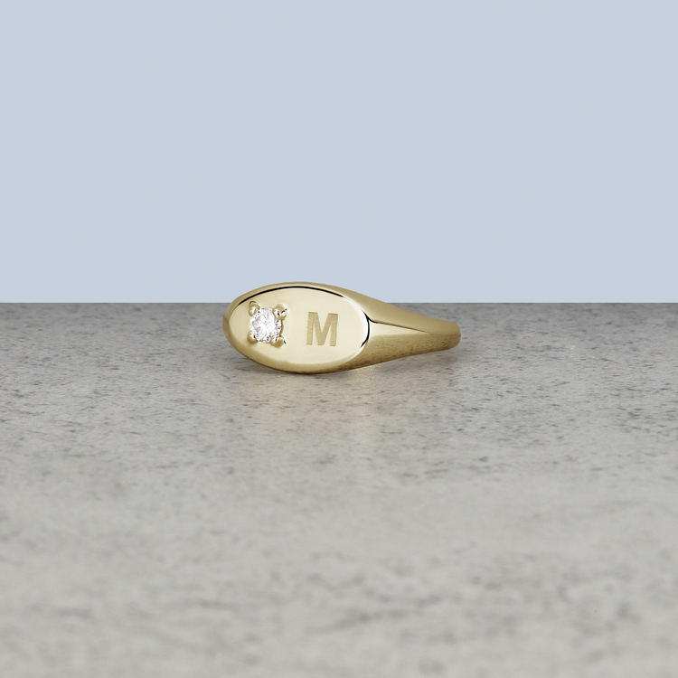 Stone and Strand 10K Yellow Gold Personalized Birthstone Signet Ring with White Topaz Engraved Editorial Image