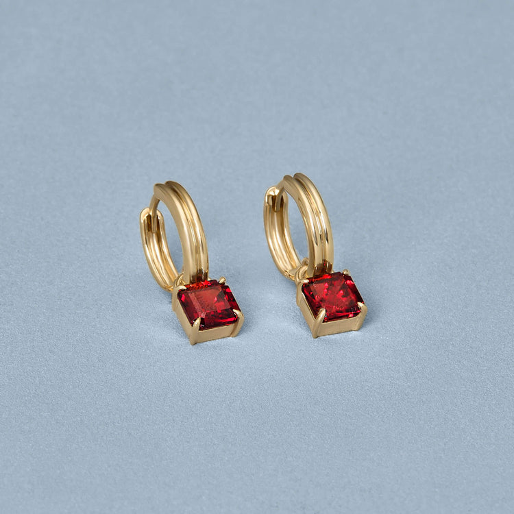 Stone and Strand 10K Yellow Gold Red Studio Garnet Huggies Editorial Image