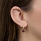 Image of 10K Yellow Gold Red Studio Garnet Huggies on Models Ear