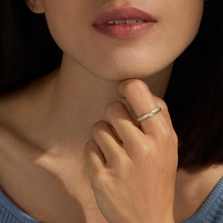 Image of 10K Yellow Gold Dainty Diamond Pirouette Band on Models Hand