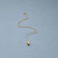 Stone and Strand 14K Yellow Gold Ridged Rondelle Charm Editorial Image
