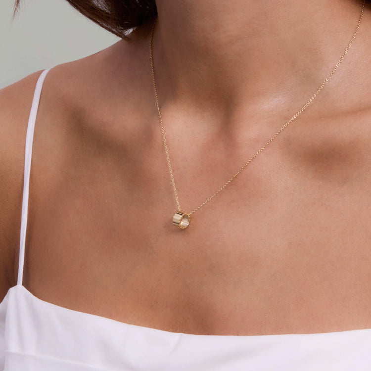 Image of 14K Yellow Gold Ridged Rondelle Charm on Models Neck
