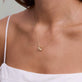 Image of 14K Yellow Gold Ridged Rondelle Charm on Models Neck