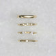 Still life image of Perfect Pear Pinch Ring with Stone and Strand solid gold jewelry